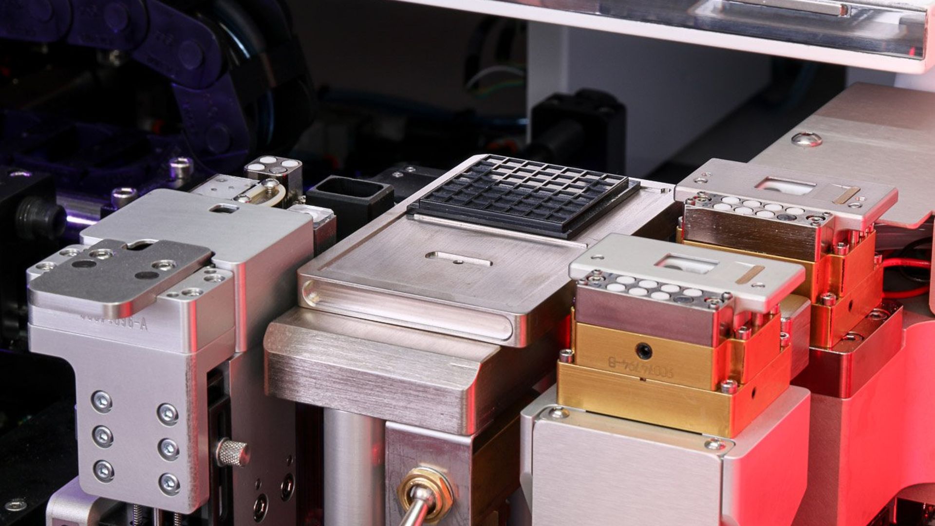 MRSI-HVM epoxy stamping well, output station, & integrated eutectic stages on shuttle