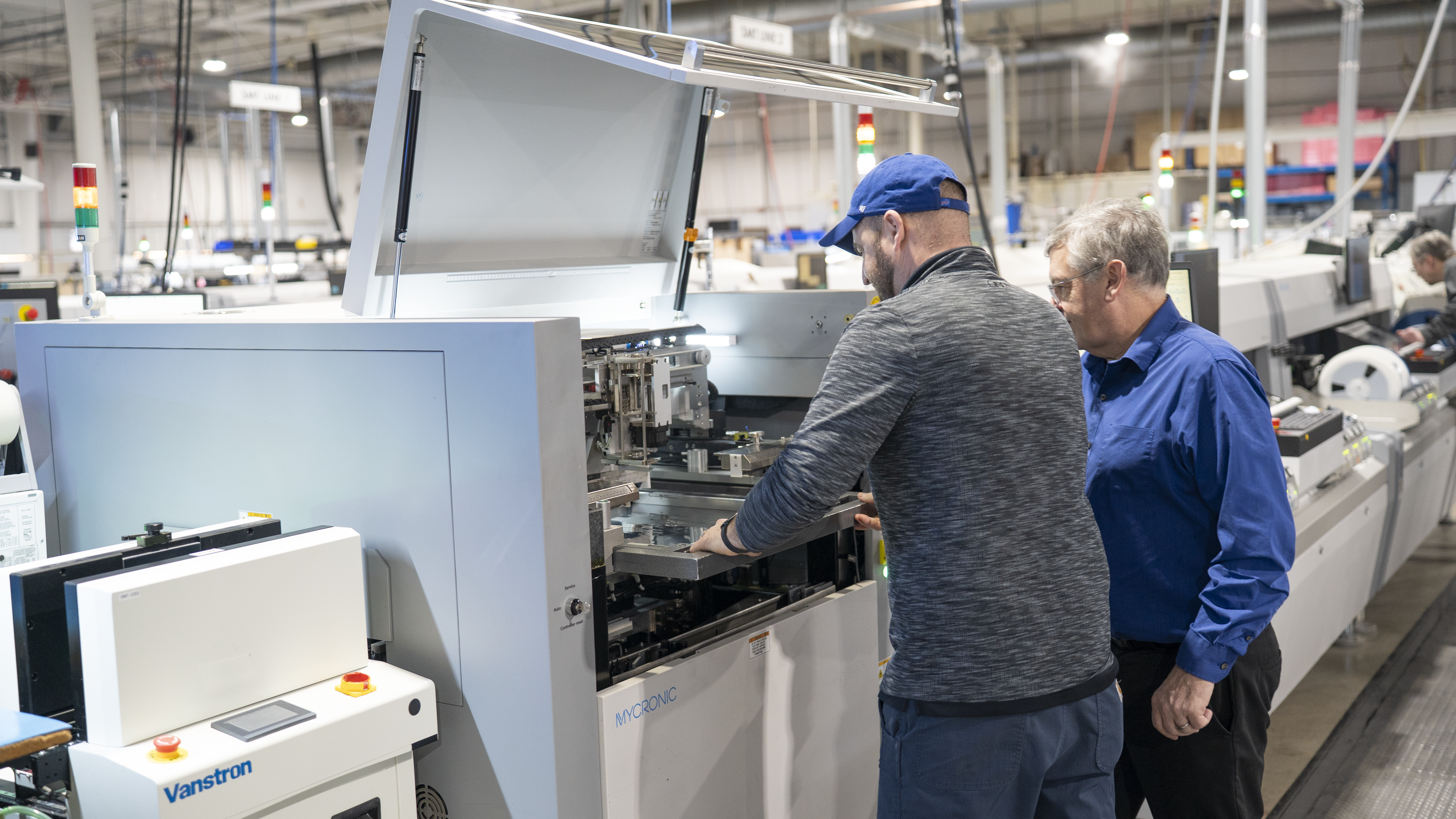 Z-AXIS team working on Mycronic SMT line
